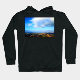 View from above on a hilly landscape under the blue sky with clouds Hoodie